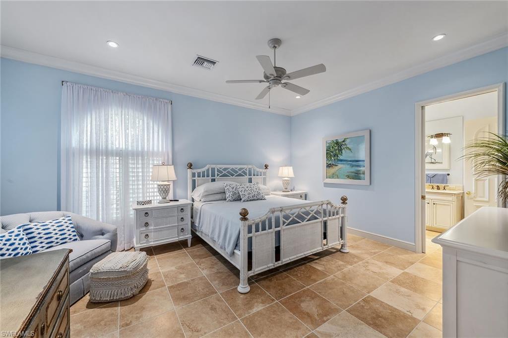 837 Barcarmil Way Naples, FL 34110 - Photo 25 of 38 a bed room with a bed and a window