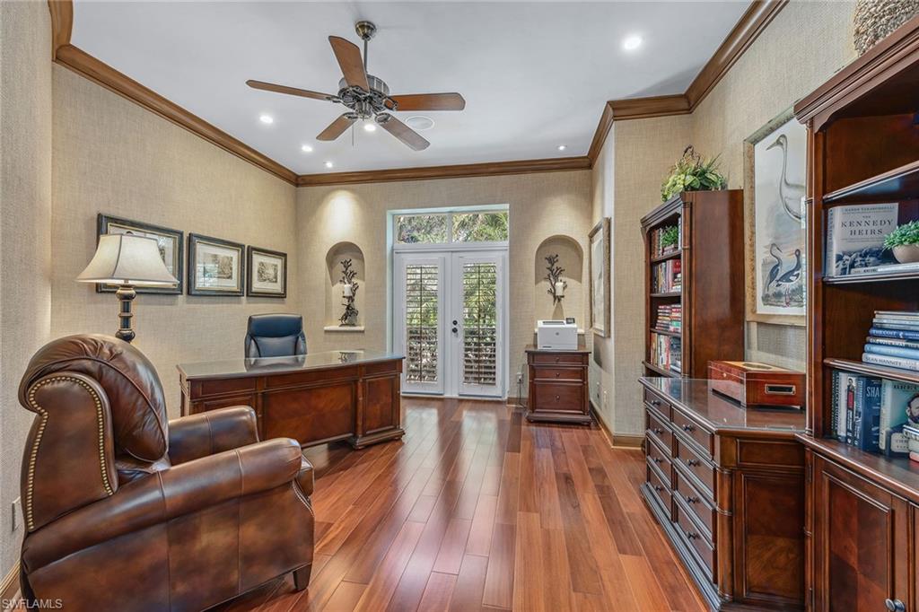 837 Barcarmil Way Naples, FL 34110 - Photo 27 of 38 a living room with furniture and a wooden floor