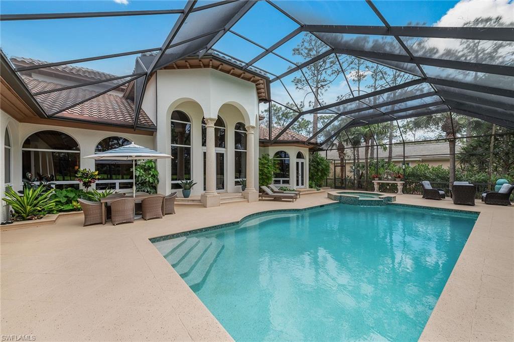 837 Barcarmil Way Naples, FL 34110 - Photo 35 of 38 a view of a swimming pool with a patio