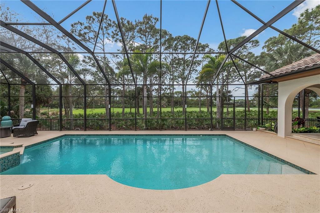 837 Barcarmil Way Naples, FL 34110 - Photo 36 of 38 a view of a swimming pool with a patio