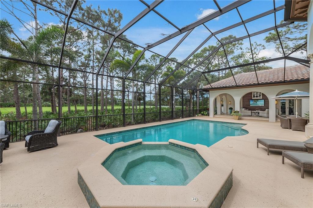 837 Barcarmil Way Naples, FL 34110 - Photo 37 of 38 a swimming pool with outdoor seating and yard