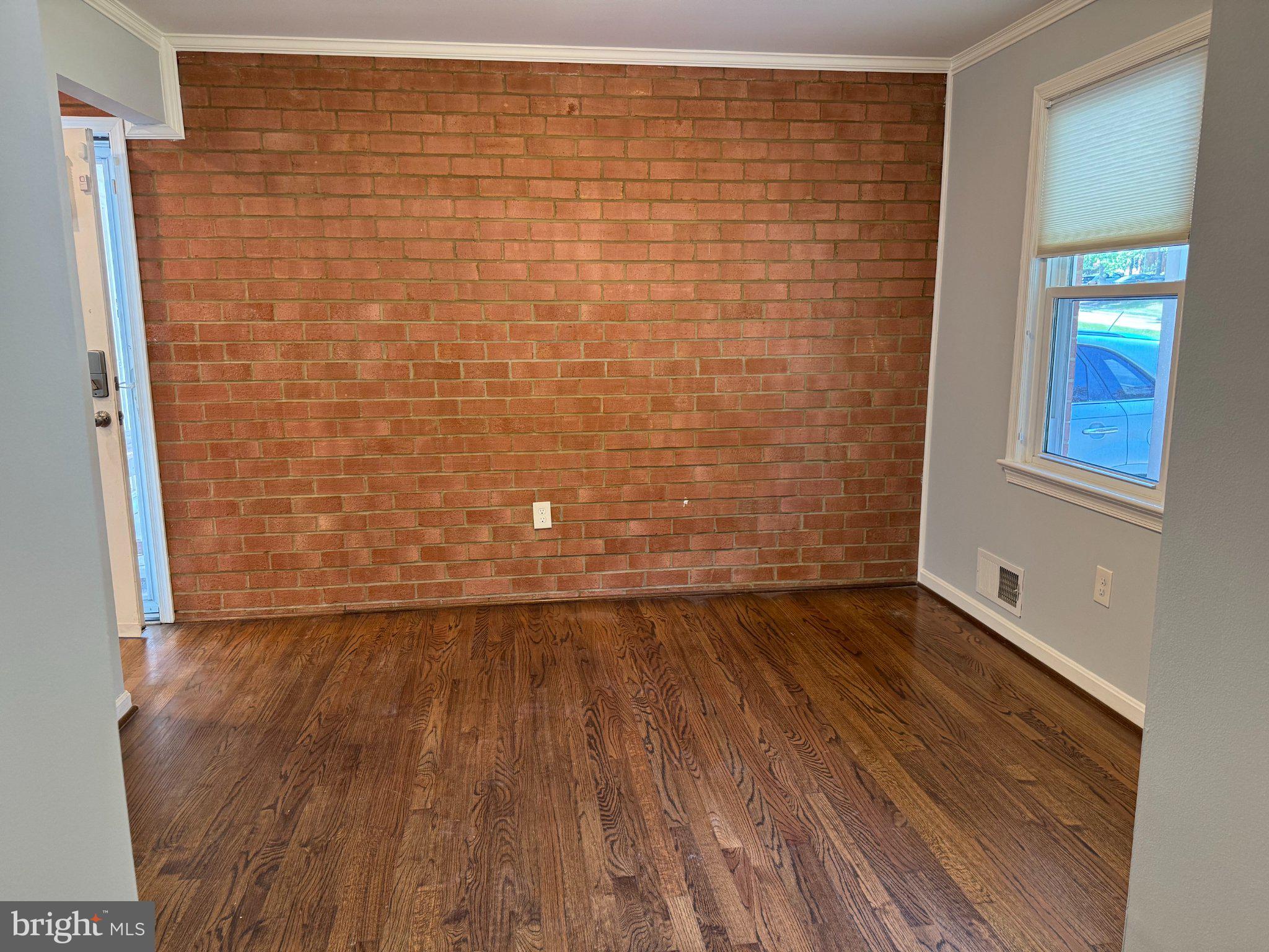 6603 Huntsman Boulevard Springfield, VA 22152 - Photo 15 of 64 Charming space with exposed brick wall.