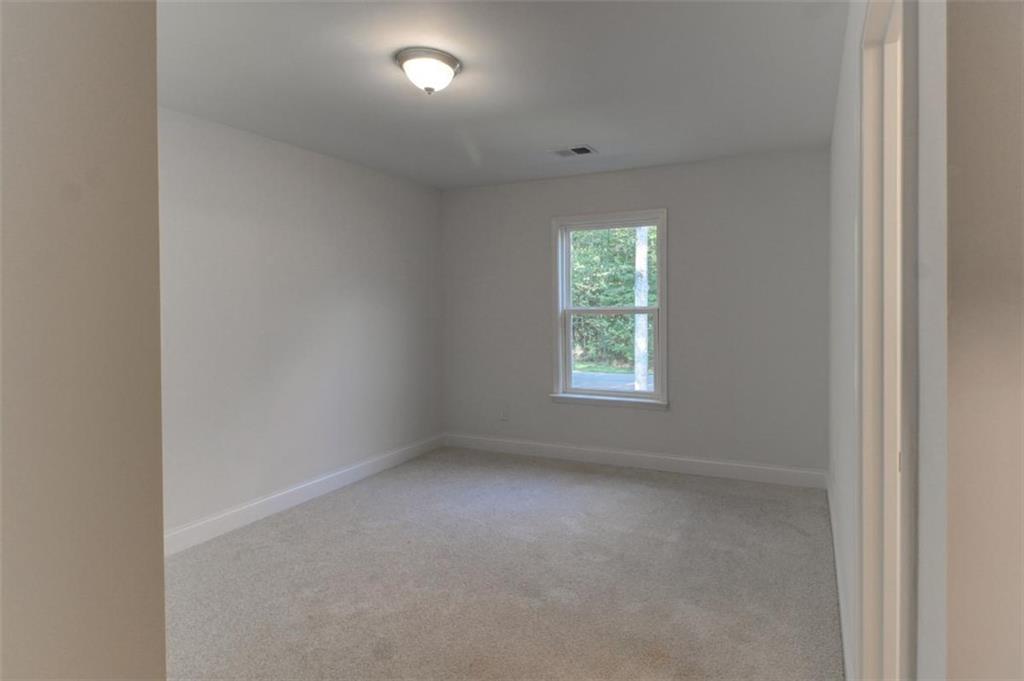 41 Woodland Road Covington, GA 30016 - Photo 43 of 46 an empty room with a window