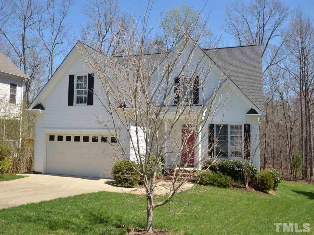 812 Nowell Ridge Road Raleigh, NC 27607 - Photo 1 of 21 a front view of a house with garden