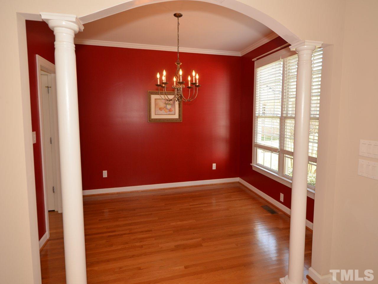 812 Nowell Ridge Road Raleigh, NC 27607 - Photo 4 of 21 a view of an empty room with a window