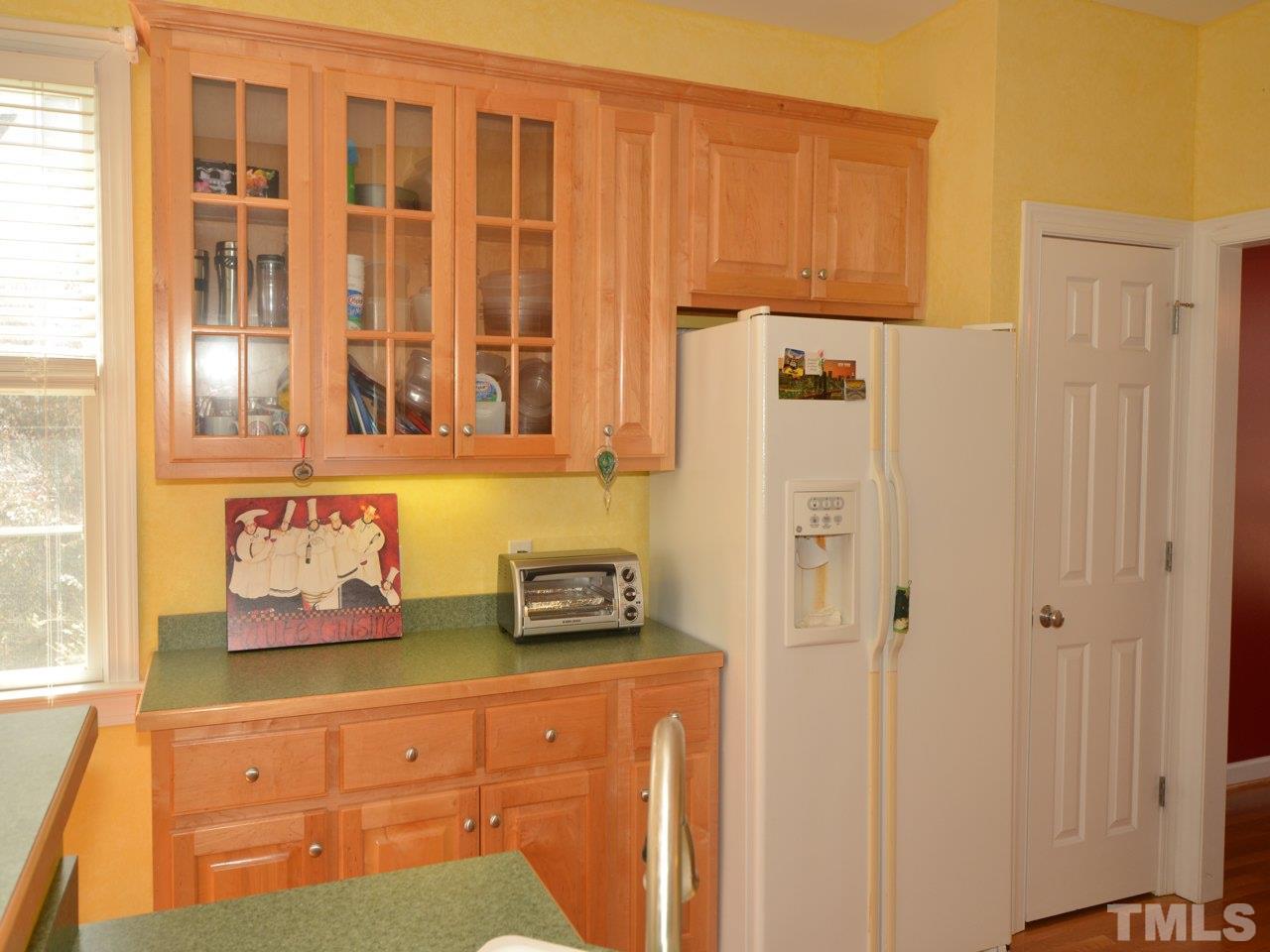812 Nowell Ridge Road Raleigh, NC 27607 - Photo 7 of 21 a cabinet with window in front of it
