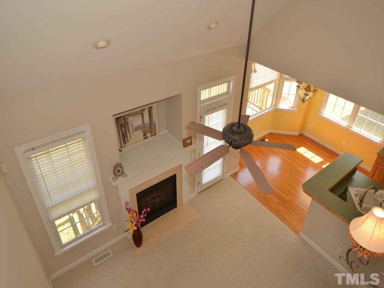 812 Nowell Ridge Road Raleigh, NC 27607 - Photo 8 of 21 a view of living room with furniture and a fireplace