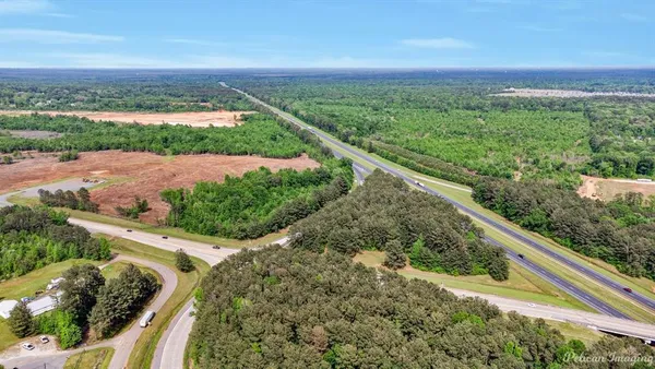 a view of a green field with an outdoor space