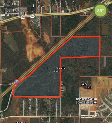 a view of a field with an ocean view