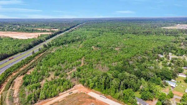 a view of a field with an ocean view