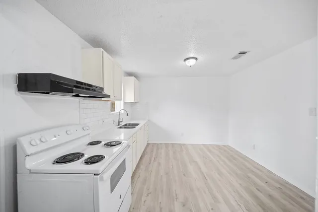 a view of storage and utility room with washer and dryer
