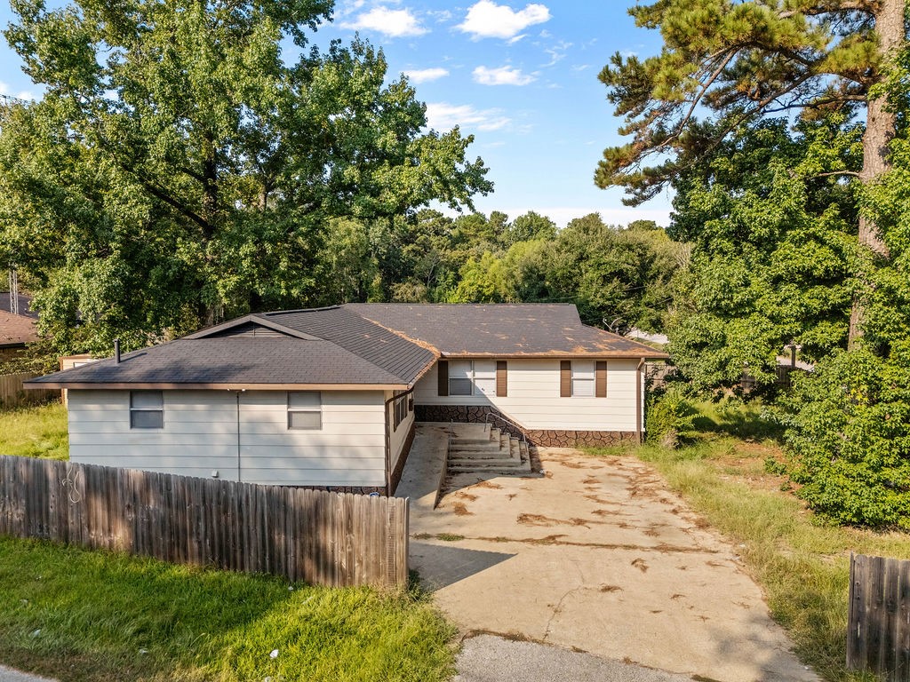 3058 Old Colony Road Huntsville, TX 77320 - Photo 2 of 25 a front view of a house with a yard