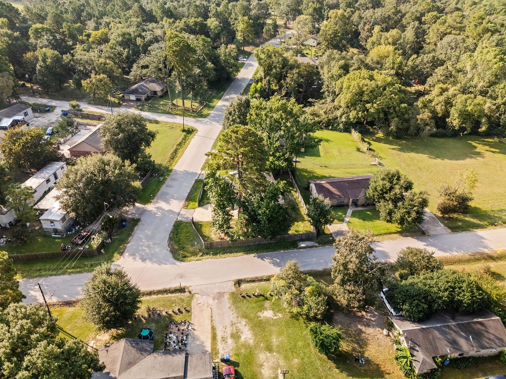 3058 Old Colony Road Huntsville, TX 77320 - Photo 25 of 25 an aerial view of a house with a yard and lake view