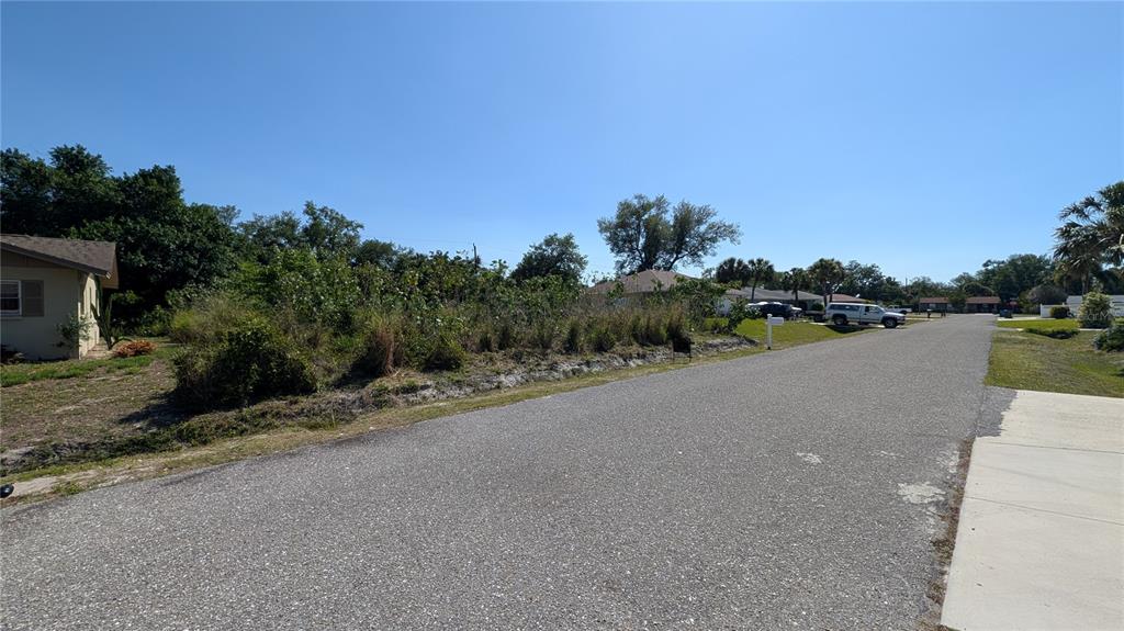 177 Columbia Road Venice, FL 34293 - Photo 3 of 3 a view of a road with a building in the background