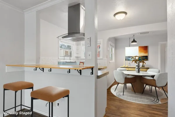 a view of kitchen with cabinets and wooden floor
