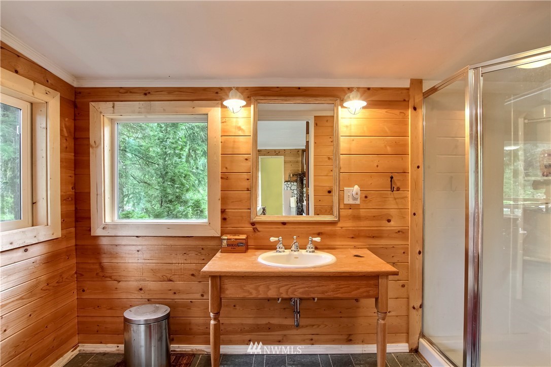 50229 Loop Road Gold Bar, WA 98251 - Photo 16 of 21 a bathroom with a granite countertop sink and a mirror