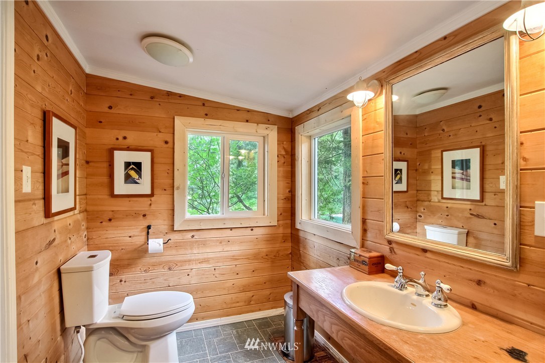 50229 Loop Road Gold Bar, WA 98251 - Photo 17 of 21 a bathroom with a sink a toilet a mirror and a tub