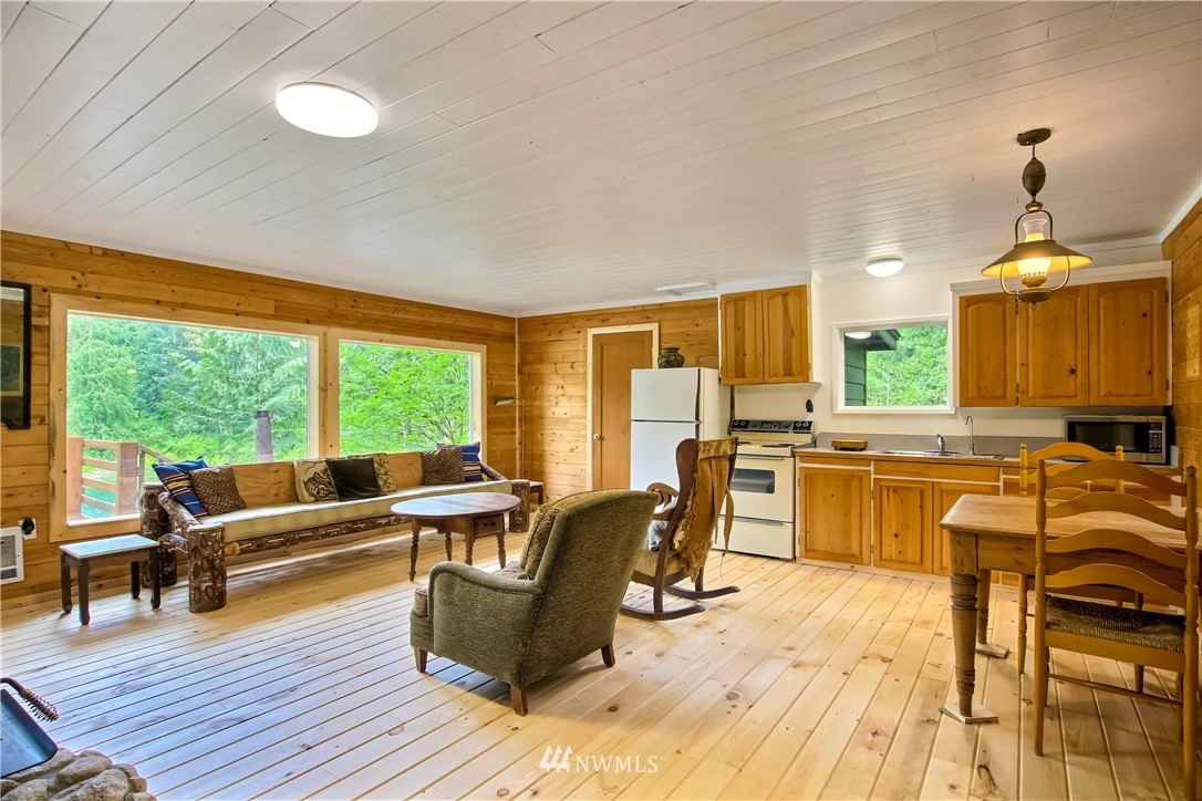 50229 Loop Road Gold Bar, WA 98251 - Photo 8 of 21 a living room with furniture and large windows