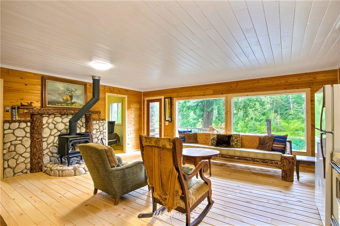 50229 Loop Road Gold Bar, WA 98251 - Photo 9 of 21 a living room with furniture and floor to ceiling windows