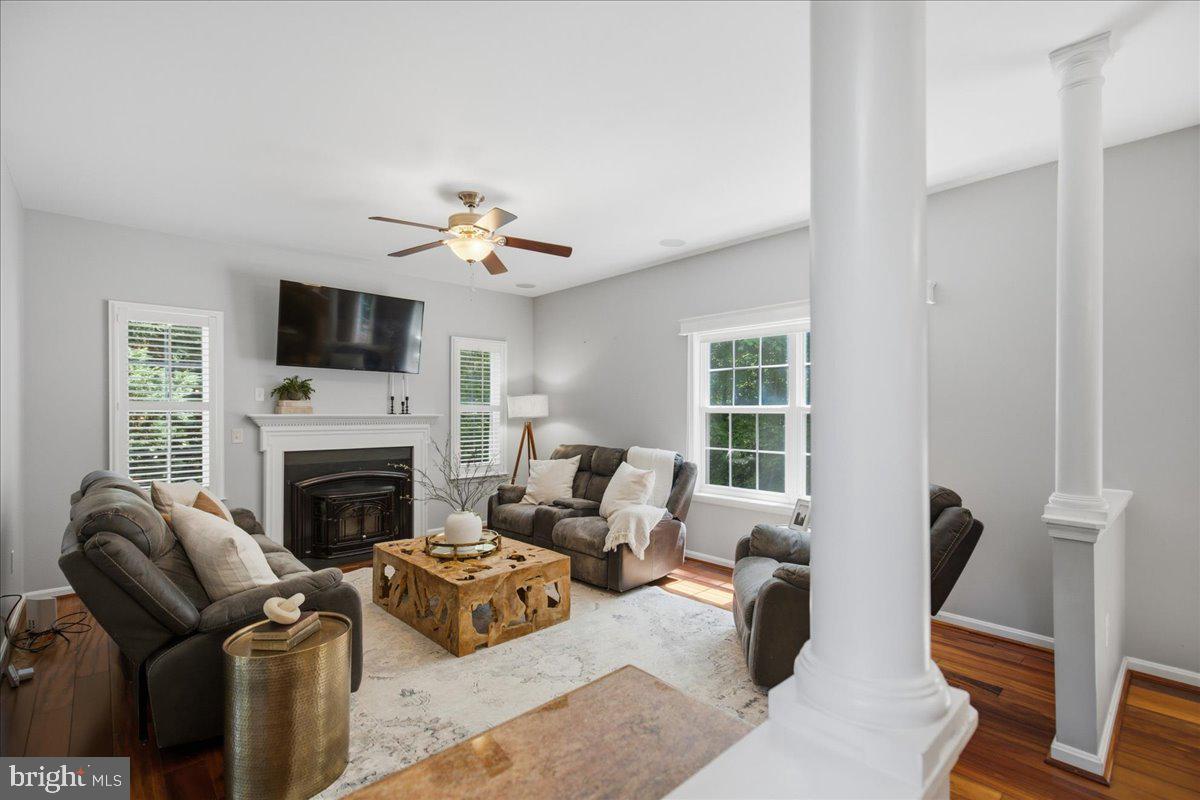 2424 Springbrook Court Huntingtown, MD 20639 - Photo 21 of 103 a living room with furniture a fireplace and a flat screen tv