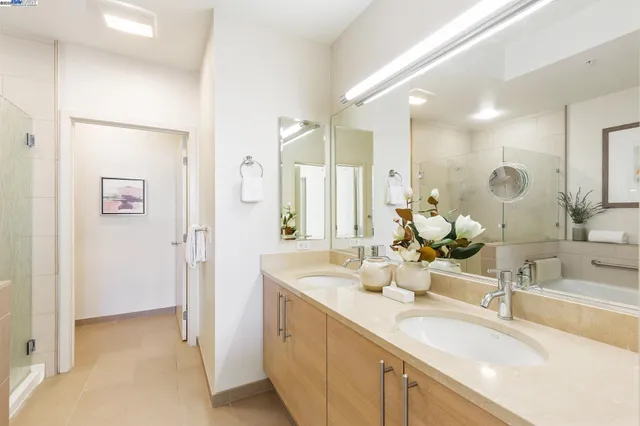 a bathroom with a double vanity sink mirror and double
