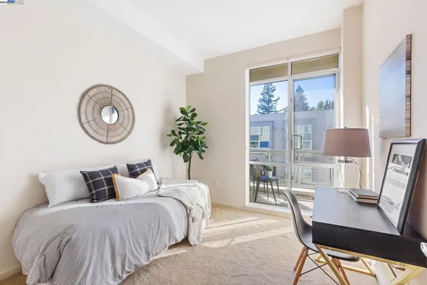 a bedroom with a large bed and a table