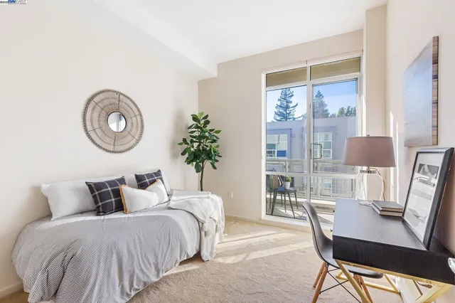 a bedroom with a large bed and a table