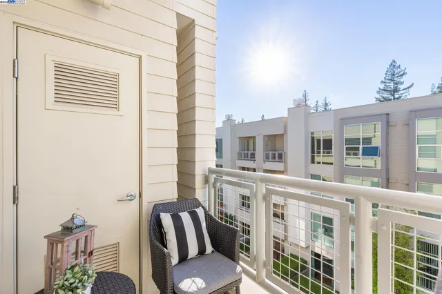 a view of a balcony with chairs