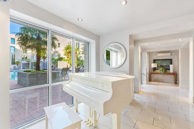 a view of a patio with table and chairs and potted plants
