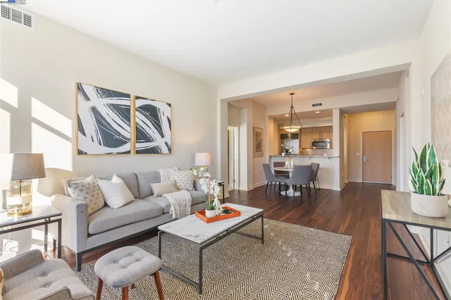 a living room with furniture and a table