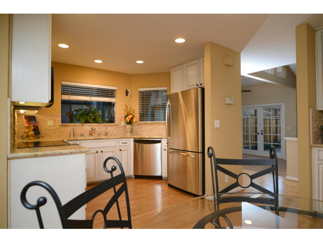 133 Redding Road, Unit B Campbell, CA 95008 - Photo 4 of 12 a kitchen with a refrigerator and a stove top oven