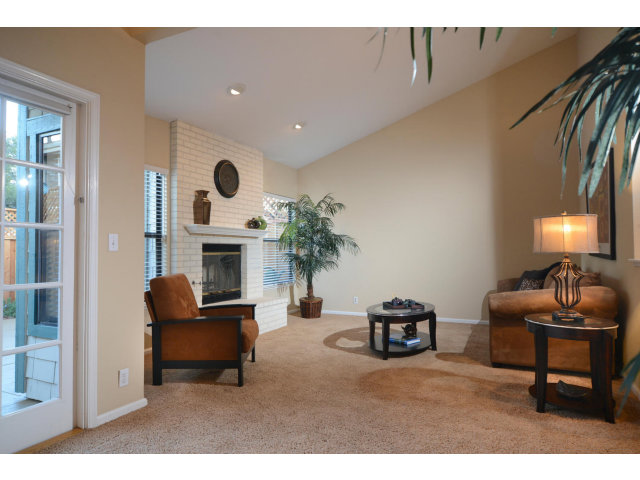 133 Redding Road, Unit B Campbell, CA 95008 - Photo 8 of 12 a living room with furniture and a fireplace