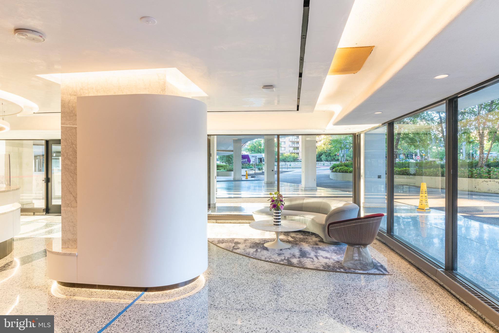 2500 Virginia Avenue Northwest, Unit 1005S Washington, DC 20037 - Photo 34 of 42 a living room with large windows