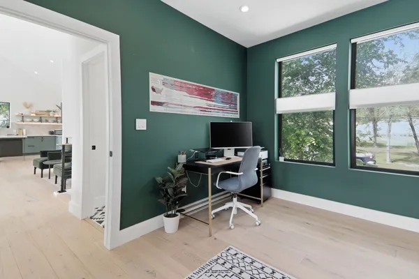 a view of a dining room with furniture window and wooden floor