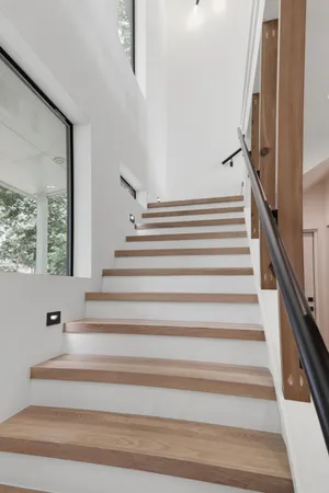 a balcony with table and chairs