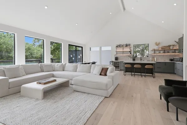 a dining table with chairs and wooden floor