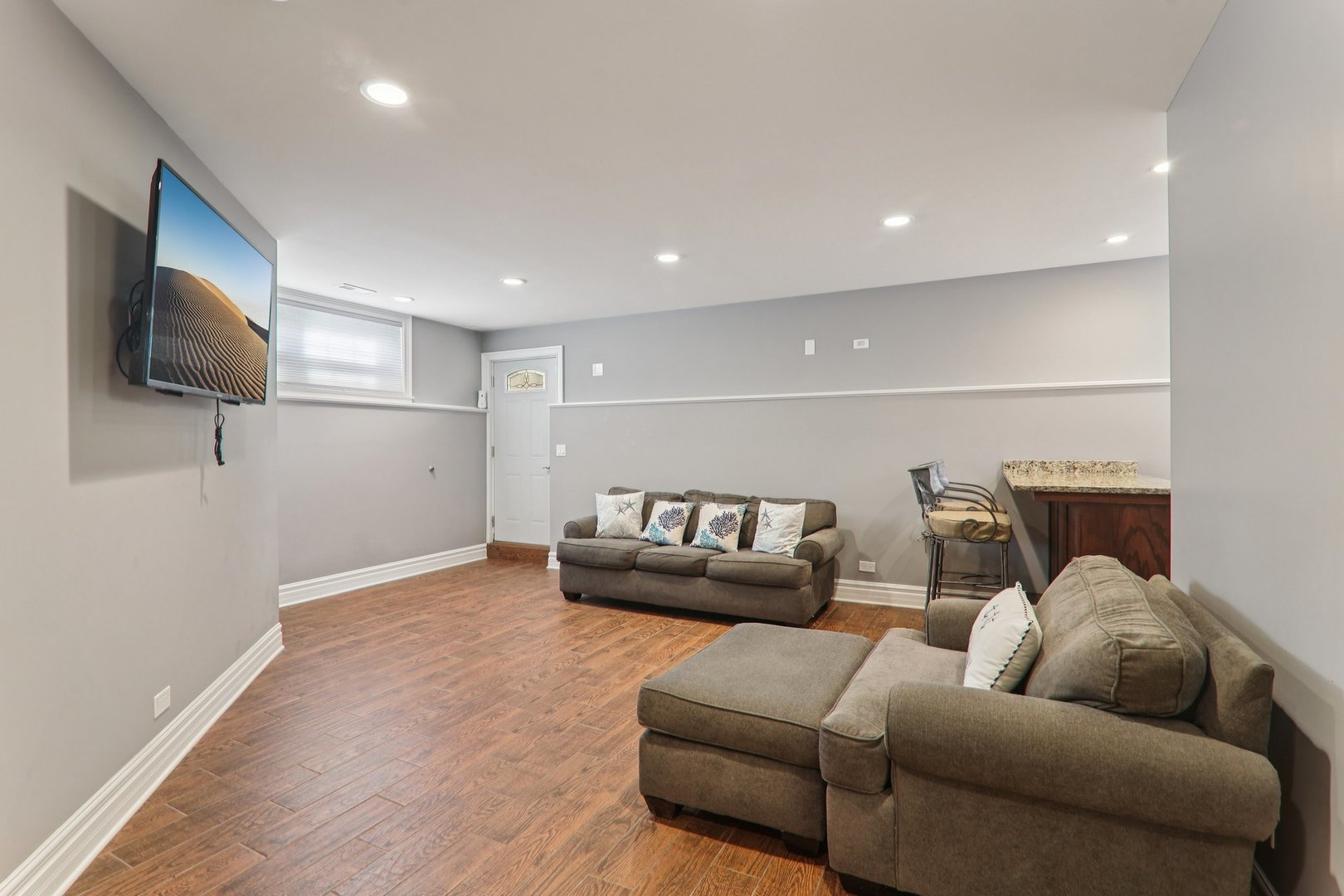 124 Hubbard Court Wauconda, IL 60084 - Photo 24 of 47 a living room with furniture and a flat screen tv