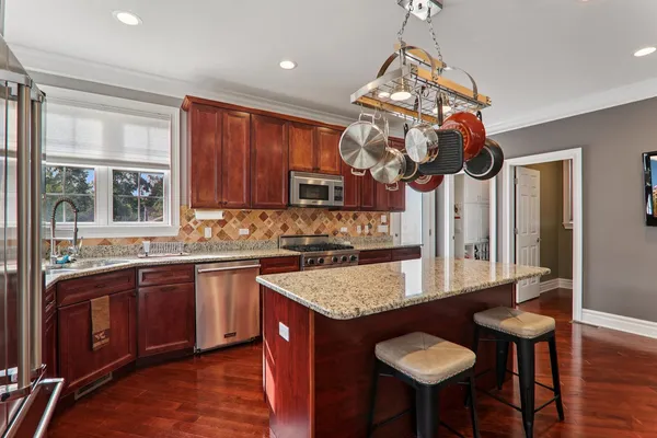 a kitchen with stainless steel appliances granite countertop counter space a sink and cabinets