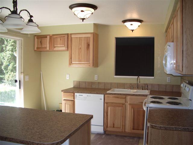930 North Granger Road Granger, WA 98932 - Photo 11 of 19 a kitchen with a sink appliances and a window