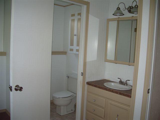 930 North Granger Road Granger, WA 98932 - Photo 7 of 19 a bathroom with a sink a toilet and shower
