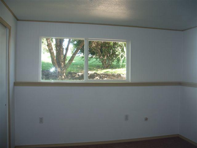 930 North Granger Road Granger, WA 98932 - Photo 9 of 19 a view of a room that has a window in it
