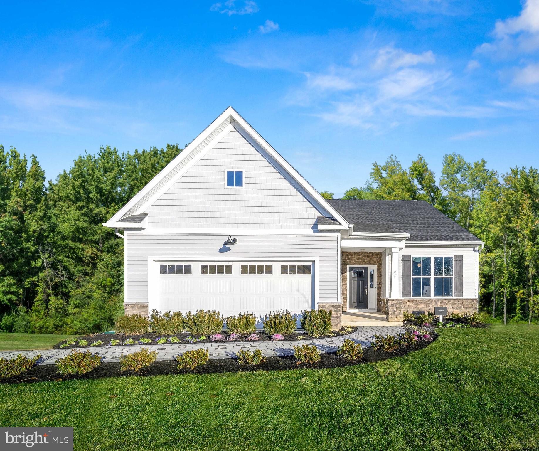 a view of house with backyard