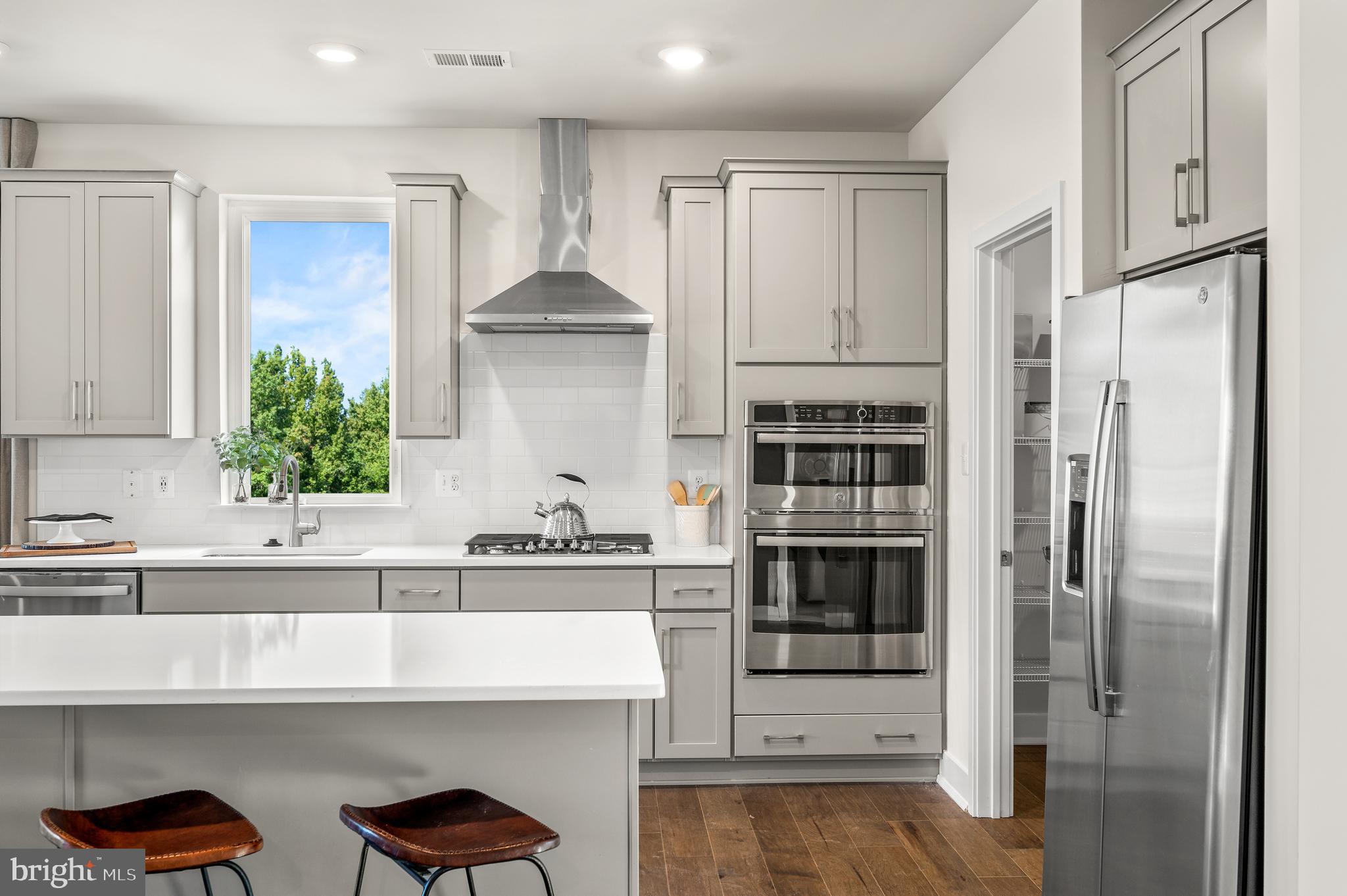 15 Saddleford Road Smyrna, DE 19977 - Photo 13 of 37 a kitchen with stainless steel appliances a refrigerator and a stove