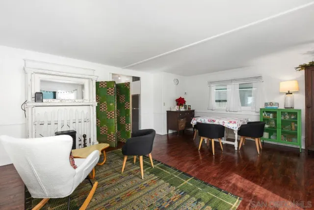 a large kitchen with a table and chairs