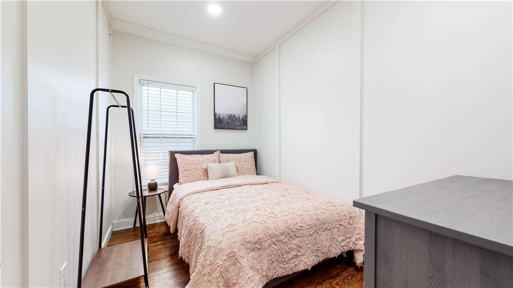69 Atlanta Avenue Southwest Atlanta, GA 30315 - Photo 20 of 29 a bedroom with a bed and a dresser