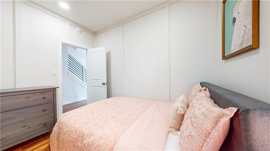 69 Atlanta Avenue Southwest Atlanta, GA 30315 - Photo 21 of 29 a bedroom with a bed and a dresser