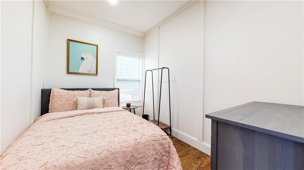 69 Atlanta Avenue Southwest Atlanta, GA 30315 - Photo 22 of 29 a bed room with a bed and a painting