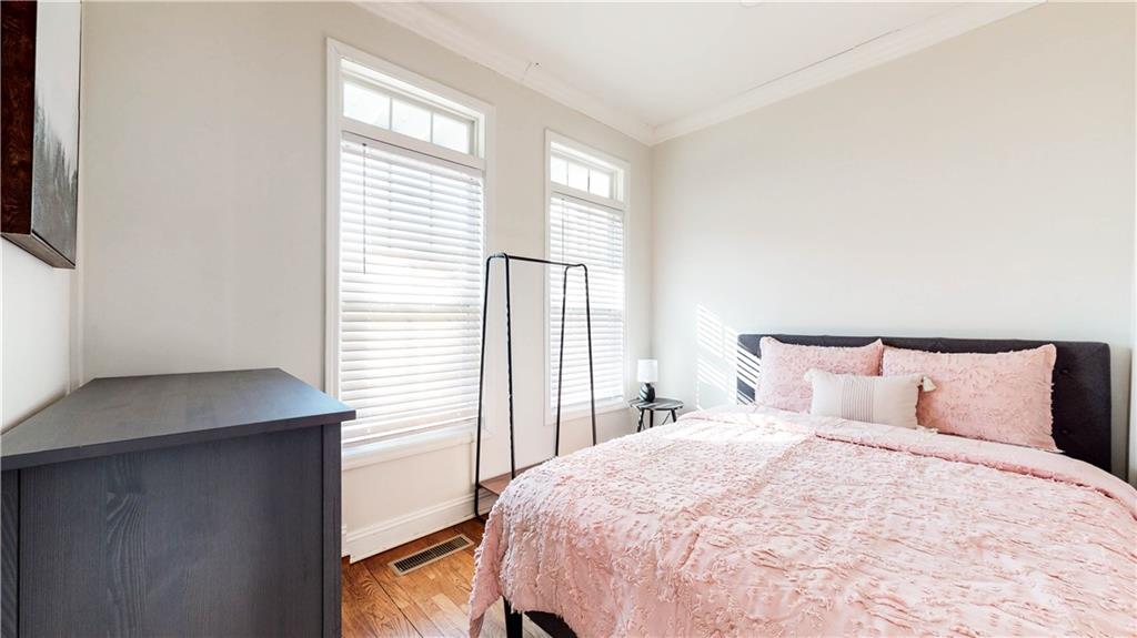 69 Atlanta Avenue Southwest Atlanta, GA 30315 - Photo 23 of 29 a bedroom with a bed and a window