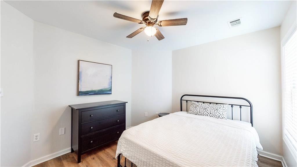 69 Atlanta Avenue Southwest Atlanta, GA 30315 - Photo 5 of 29 a bedroom with a bed and a table