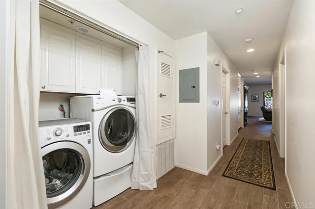 a living room with patio furniture and a potted plant